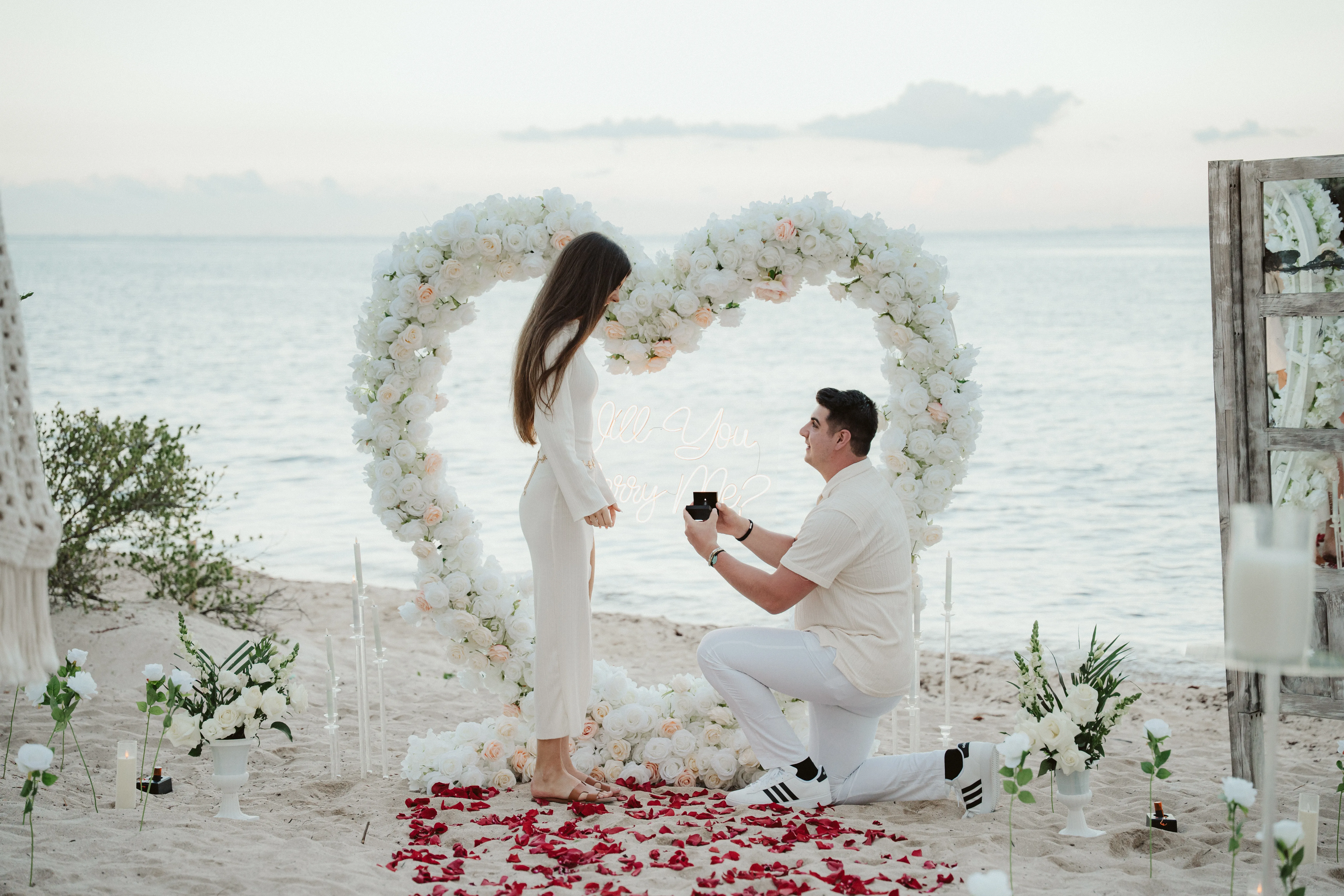 Sunset proposal with ocean backdrop