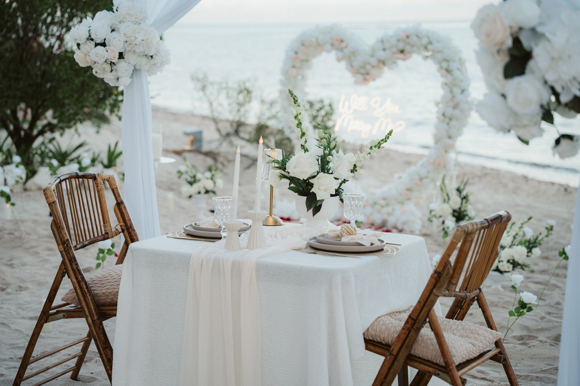 Intimate beach moment in Tulum during a proposal photoshoot, capturing the couple's joy in the soft golden light of the Mexican Caribbean.