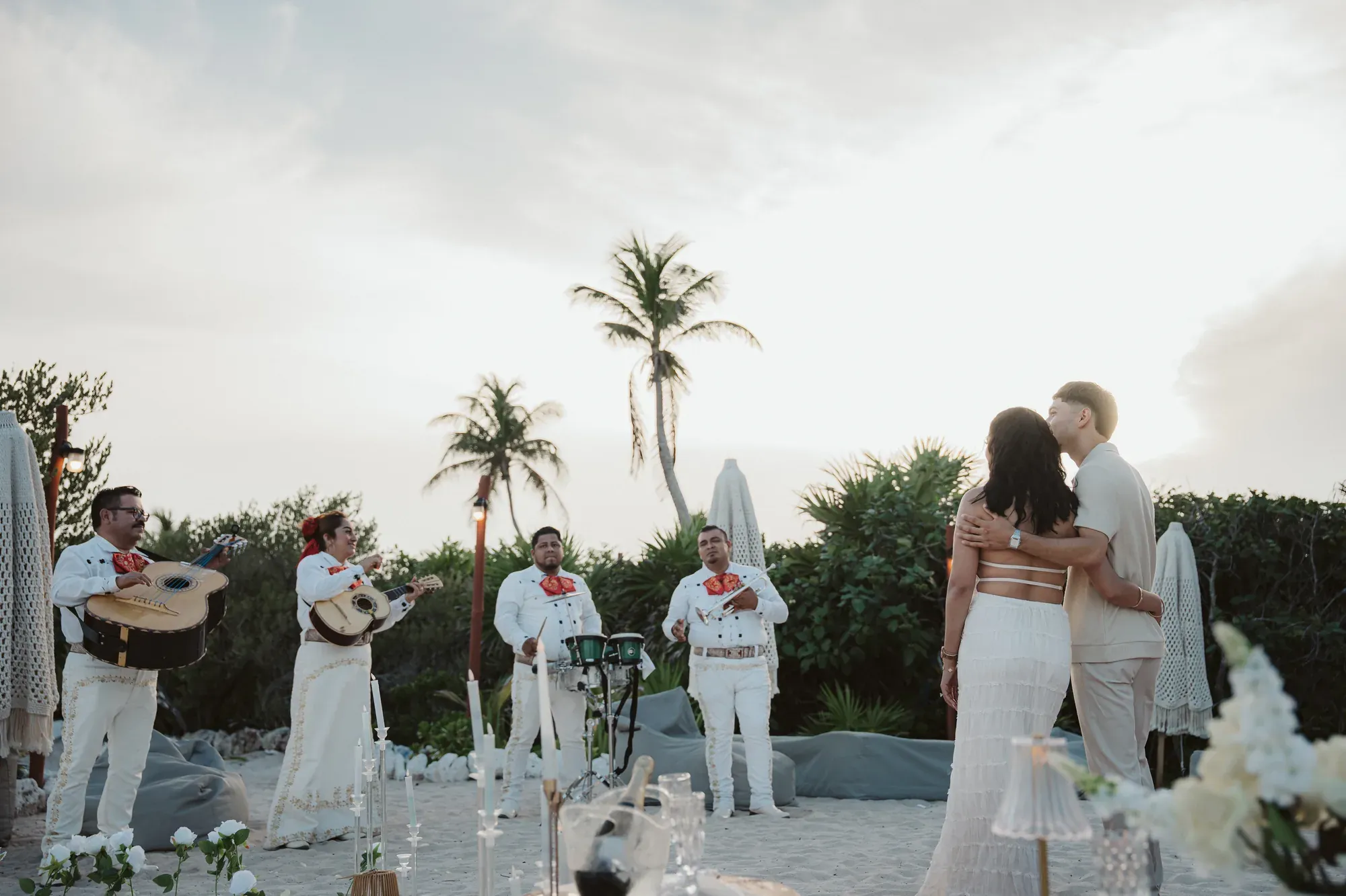 Couple listening to mariachi during their celebration