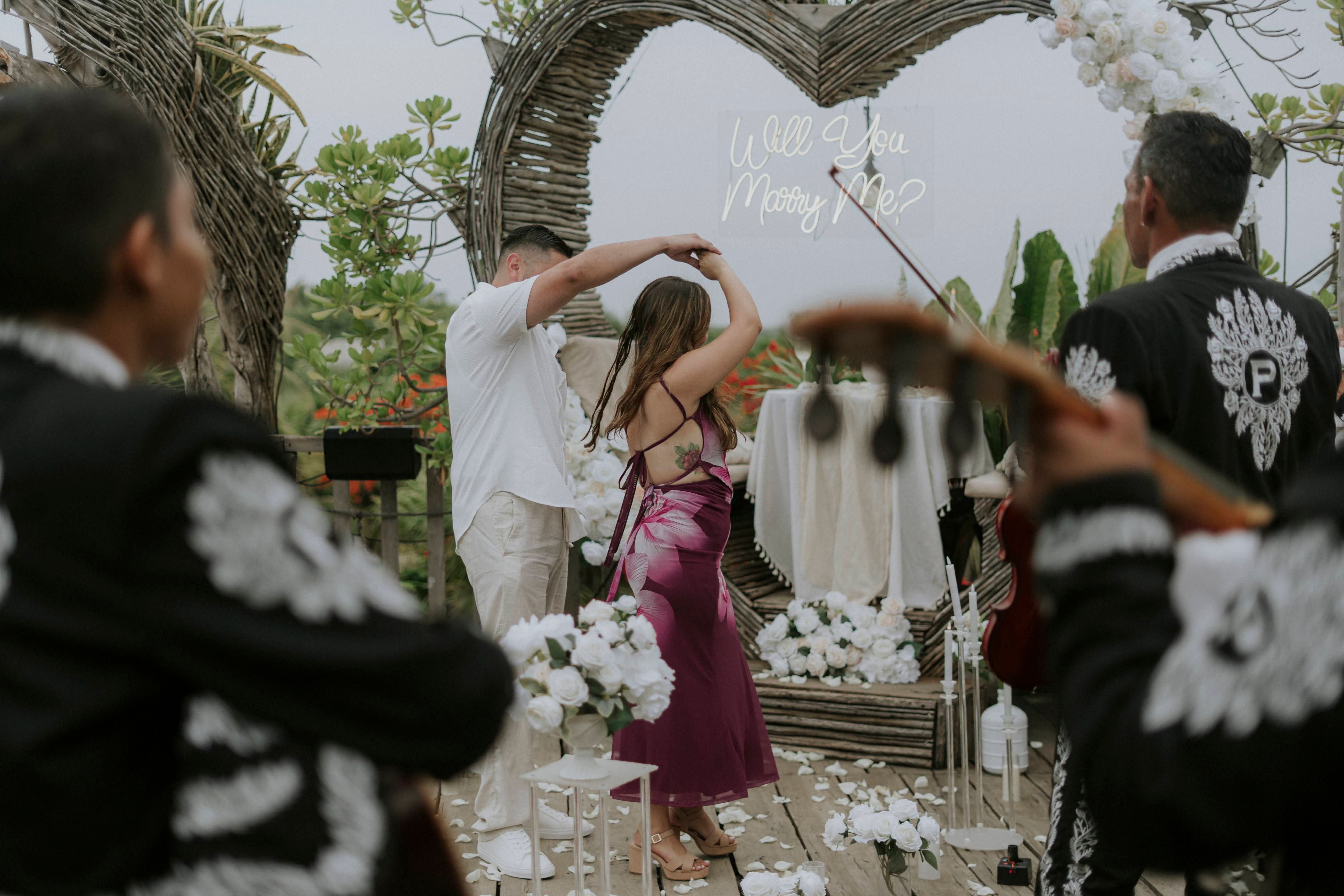 Romantic dinner setup on a luxury yacht in Cancun for a surprise marriage proposal, featuring gourmet catering and the open sea.